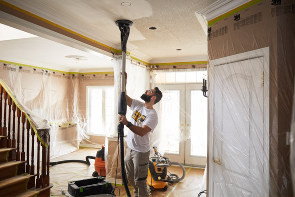Popcorn Ceiling Removal by Our Employee
