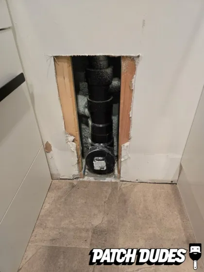 fixing holes in bathroom wall